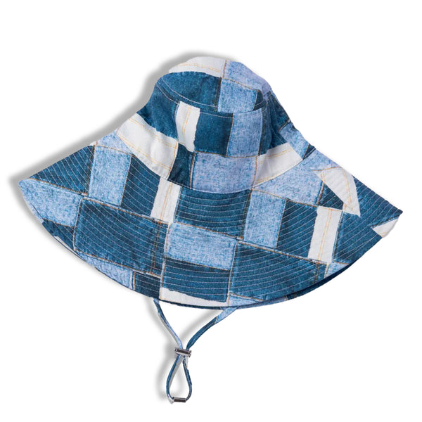 A denim pattern cloth wide-brimmed sun hat with a ribbon to secure it under the chin, displayed on a plain white background.