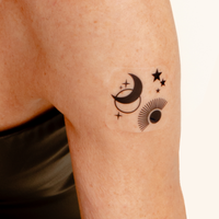 An individual wearing a daily defense vitamin patch on their armt.