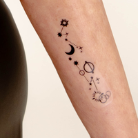 An individual wearing a daily defense vitamin patch on their forearm.