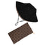 Reversable black sun hat with a textured pattern and an adjustable strap, alongside a brown BAG with a darker brown floral-like pattern and a zipper