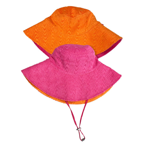 Orange and pink side of sun hat. The hat features a wide brim for sun protection and a chin strap with an adjustable toggle for a secure fit. The hat has textured design, adding a stylish touch to its functional design.