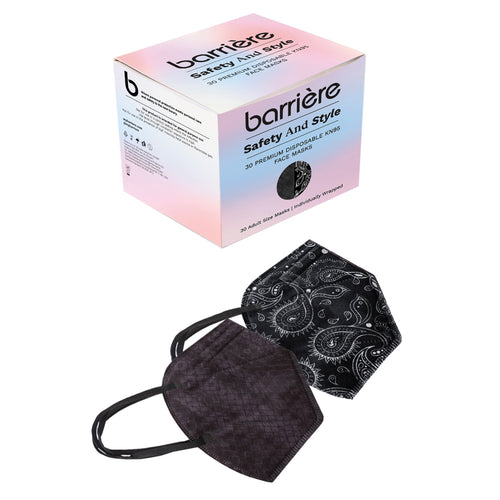 A box of disposable face masks with the brand name “barrière” and the text “safety and style” and “30 premium masks.” Below the box, there are two face masks: one with a paisley pattern and the other in a solid black color.
