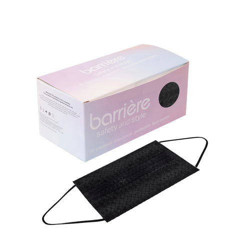 A box of 30 black disposable face masks with the brand name ‘barrière’ printed on it. The box is pink and white with a circular cut-out through which the black masks inside can be seen. Below the box, there is one black face mask displayed outside of the packaging.