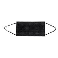 A single black face mask with ear loops lying on a white surface. The mask is designed for personal protection.