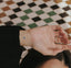 An individual with an ‘ENERGY BOOST’ vitamin patch stuck on their inner wrist featuring small blue eye.
