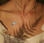 A  vitamin patch featuring four butterflies near collarbone.