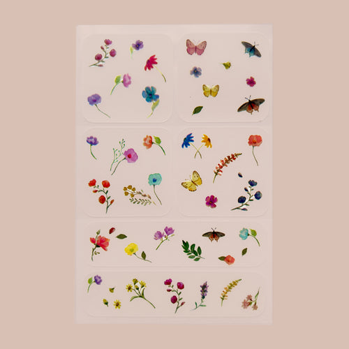 A collection of patches with various designs on a white background. Each patch features a different arrangement of colorful flowers, leaves, and insects such as butterflies.