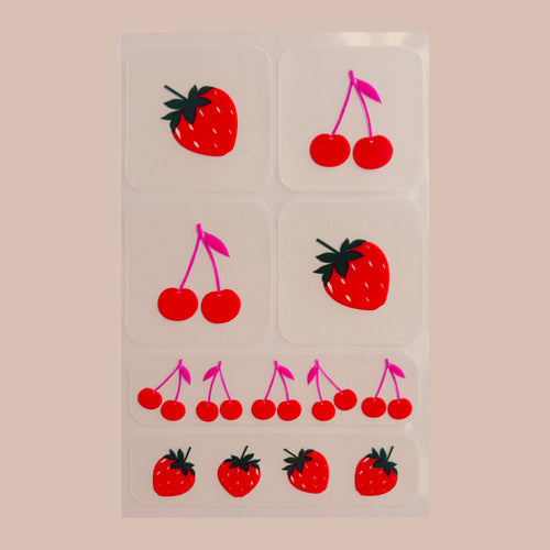  3x3 grid of squares, each containing illustrations of either strawberries or cherries. The top row has a strawberry on the left and cherries on the right. The middle row has cherries on the left, a strawberry on the right. The bottom row features an alternating pattern of cherries and strawberries from left to right.  It's placed on a begie background.