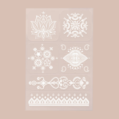 A 6-pack of white ‘Daily Defense’ patches, each with unique designs, on a beige background.