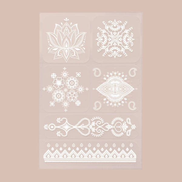 A 6-pack of white ‘Daily Defense’ patches, each with unique designs, on a beige background.