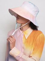 barriere UPF50+ recycled sunhat in pastel ombre on model from the side
